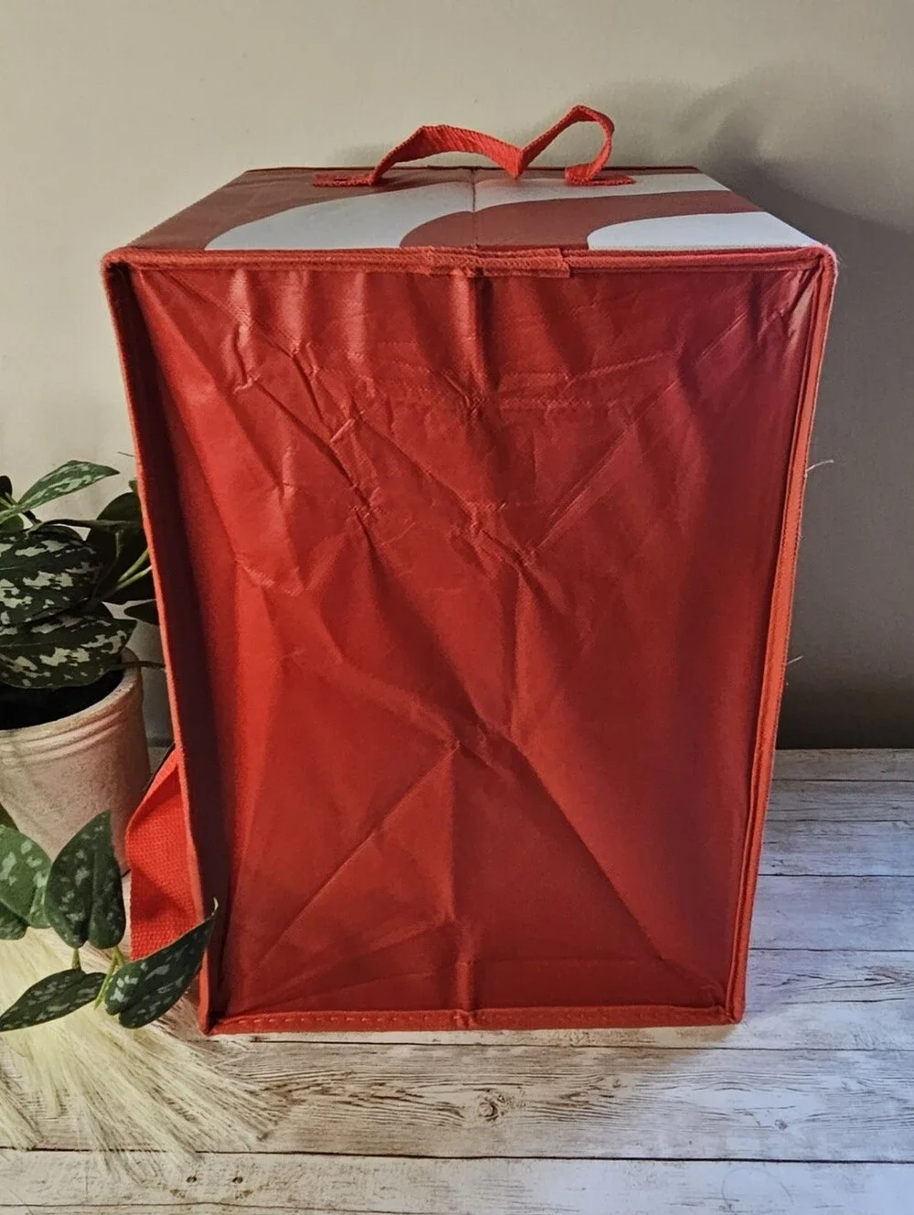 Target red collapsible box-style utility bag. It features a rectangular, boxy sh